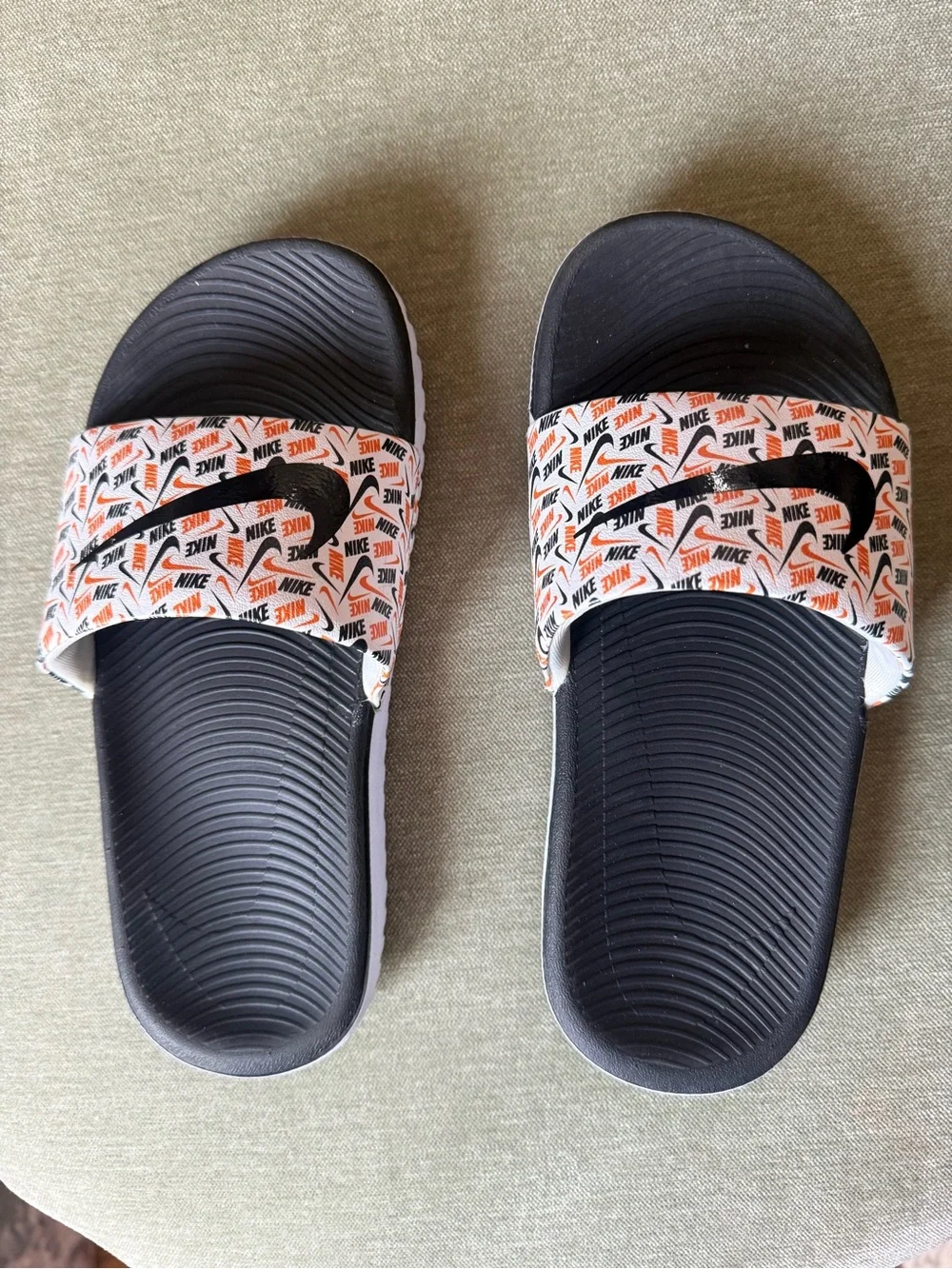 Nike Kids' Black and White Slide Sandals with Orange Logo